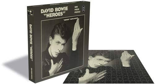 Celebrate David Bowie with this 500-piece jigsaw puzzle! Perfect for family game night or a gift for fans, it features thick, high-quality paper with no glare. Its precision-cutting ensures a perfect fit with no dust left behind. 100% officially licensed Bowie merchandise.